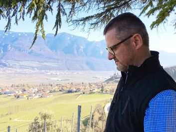 Martin Foradori looks east from the Gewürztraminer-dominated west side of the Adige Valley.                                                                (Robert Camuto)