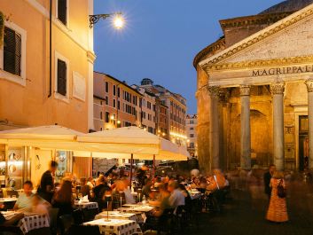 Wine is nearly always on the dinner table in Rome and the rest of Italy, where it draws people together.                                                                (Gary Yeowell/Getty)