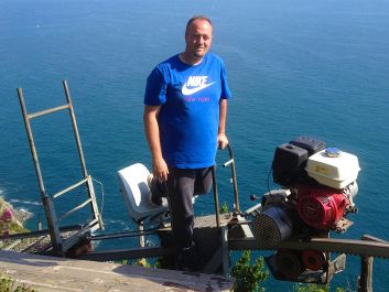 Bonanini atop his vineyards with his monorail transporter for navigating the Cinque Terre cliff sides                                                                (Robert Camuto)