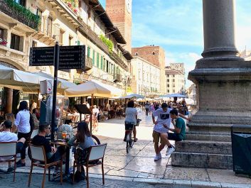 On Verona's Piazza delle Erbe, locals enjoy the chance to drink and dine outside without competing for space with summer tourists.                                                                (Robert Camuto)
